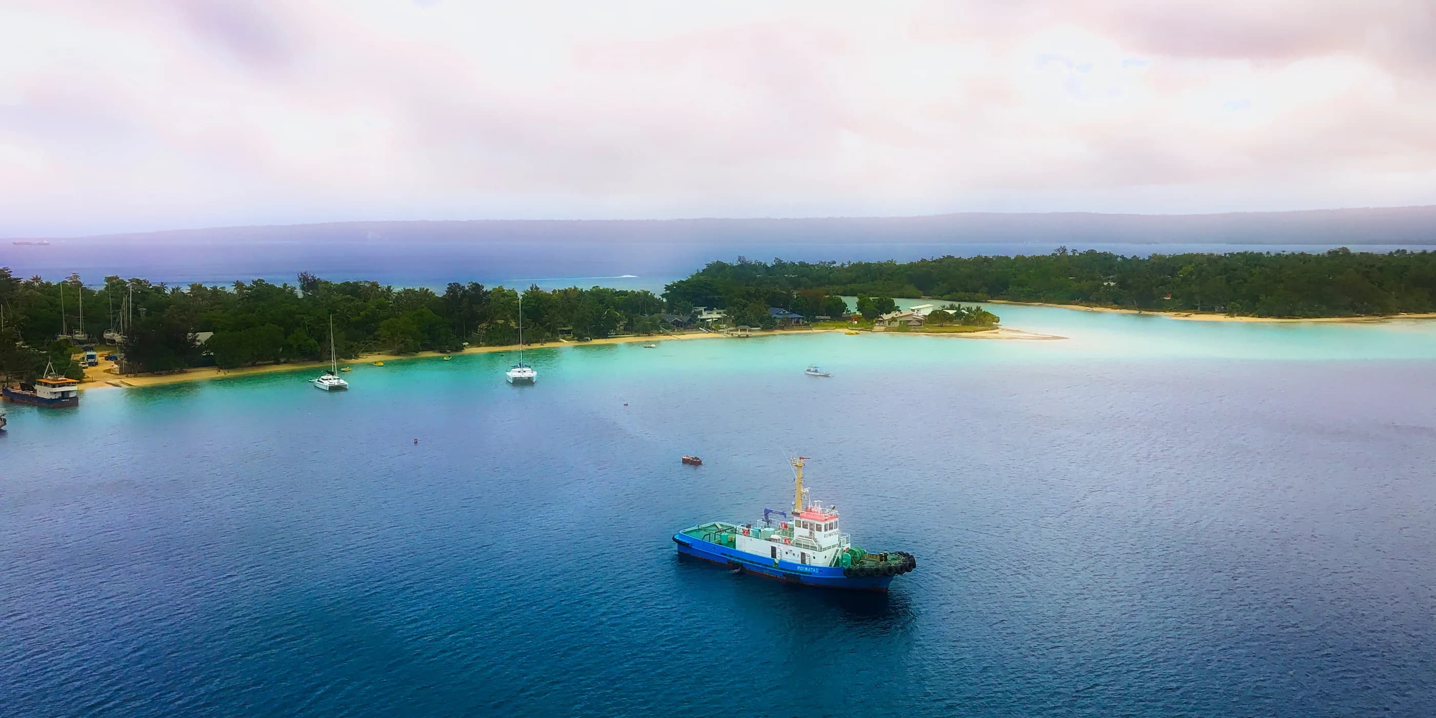 Boats on blue water in Port Vila harbour, Vanuatu.